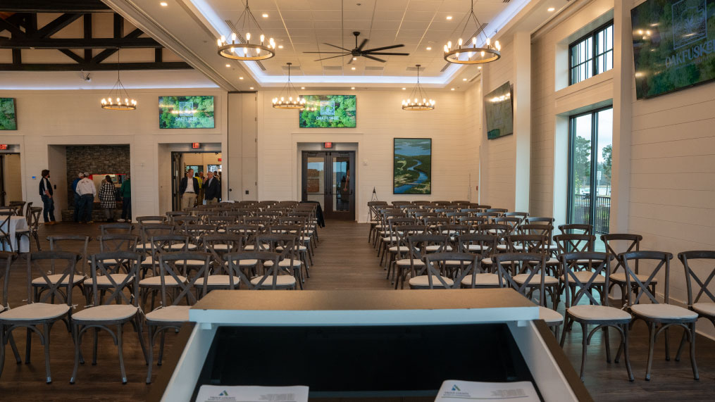 The ballroom of Oakfuskee Conservation Center set up for a meeting or wedding ceremony.