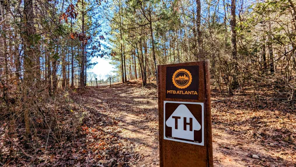 A trail marker designating Mountain Biking trails at Oakfuskee Conservation Center.