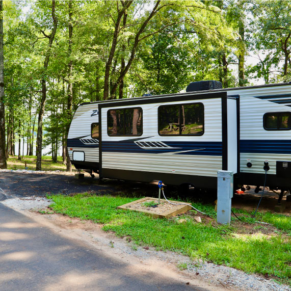 An RV, set up for camping on West Point Lake at Oakfuskee Conservation Center.