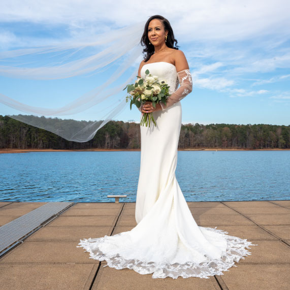 Bride in front of West Point Lake at Oakfuskee Conservation Center.