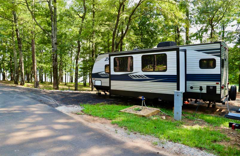 An RV, set up for camping on West Point Lake at Oakfuskee Conservation Center.